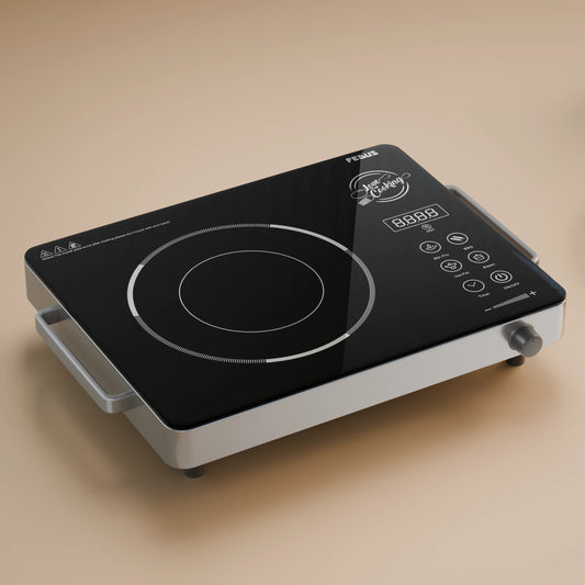 A black and silver induction cooktop, often regarded as one of the best in India, features a digital display and touch controls, elegantly placed on a beige surface.